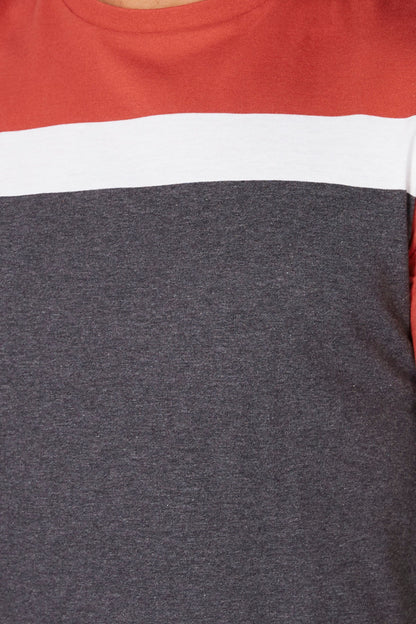 Close-up of red and dark gray color-block T-shirt with white stripe across chest