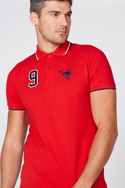 Red short-sleeve polo shirt with number 9 patch and small chest logo