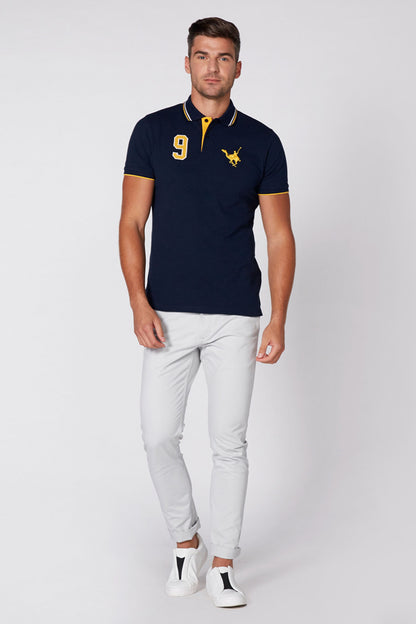 Navy polo shirt with yellow number 9 and embroidered logo, short sleeves