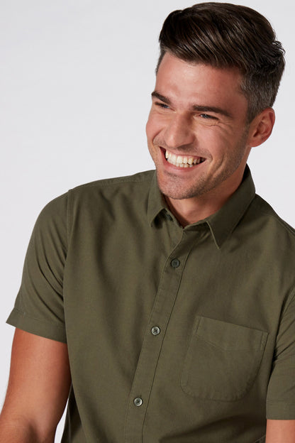 Green button-up short-sleeve shirt with chest pocket and buttoned collar