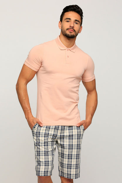 Men's pink polo shirt with plaid shorts, short sleeves and button collar