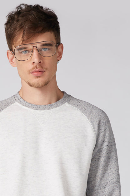 Grey-and-white raglan crew-neck sweatshirt, close-up of neckline and sleeves