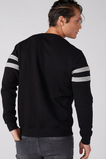 Black crewneck sweatshirt with gray stripe bands on sleeves; back view