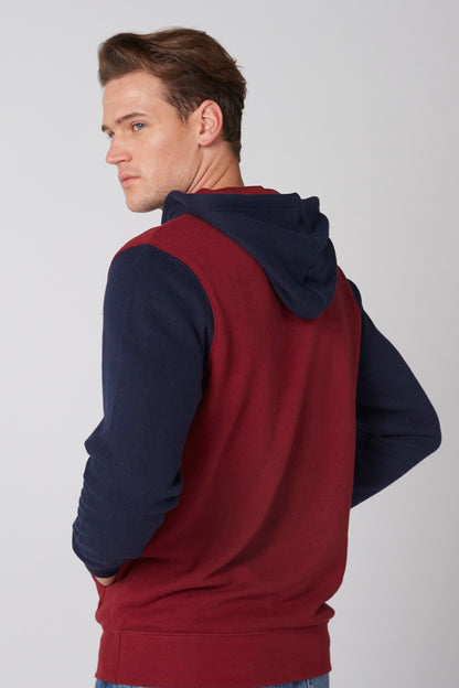 Two-tone burgundy and navy hoodie, back view with hood and drawstring, pullover