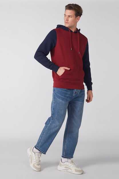 Two-tone burgundy and navy pullover hoodie with hood and drawstring, front pocket