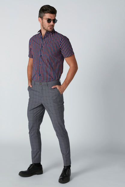 Men's short-sleeve plaid button-up shirt in red, blue, and navy tones