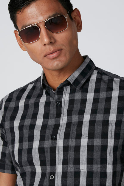 Men's black-and-gray plaid button-up short-sleeve shirt, front view