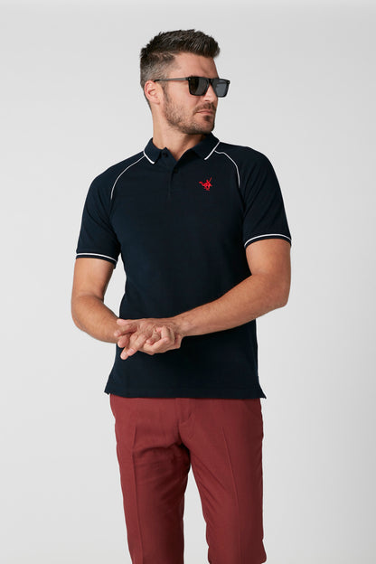 Navy polo shirt with red logo and white piping, short sleeves