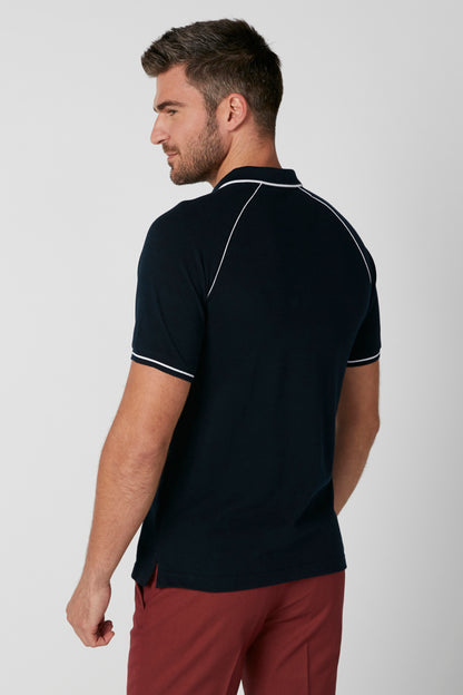 Navy polo shirt back view, white piping along collar and sleeves