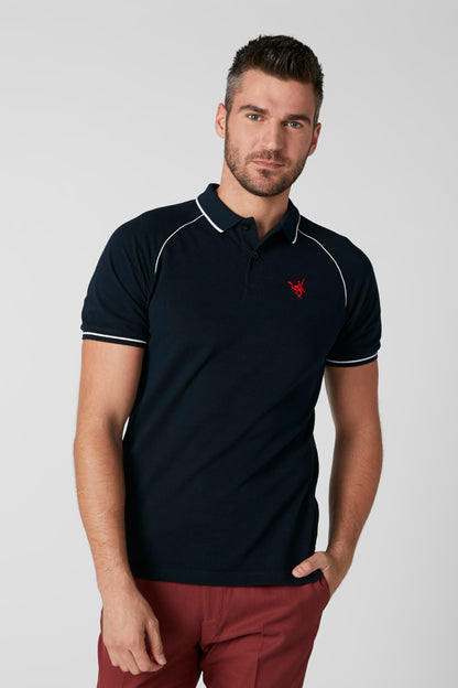 Navy polo shirt with red chest logo, white-trimmed collar and sleeves