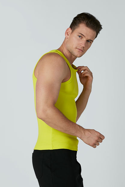 Neon green sleeveless tank top and black athletic shorts, side view