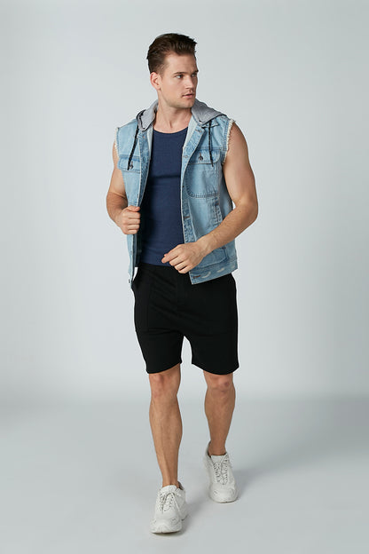 Navy sleeveless tank top under a light blue denim vest, paired with black shorts