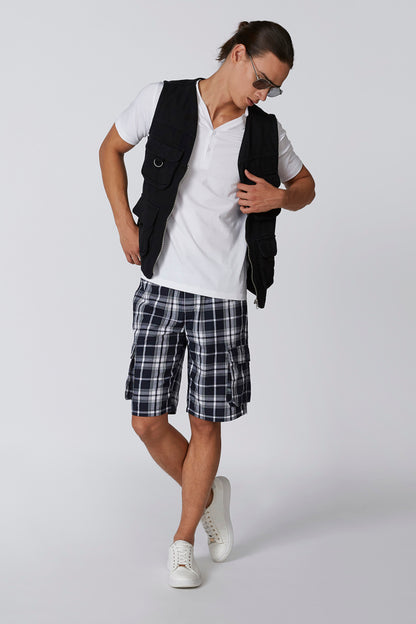 White short-sleeve V-neck t-shirt worn with black outer bag and shorts