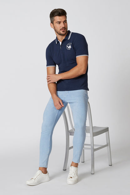 Navy short-sleeve polo shirt with white striped collar, small chest emblem