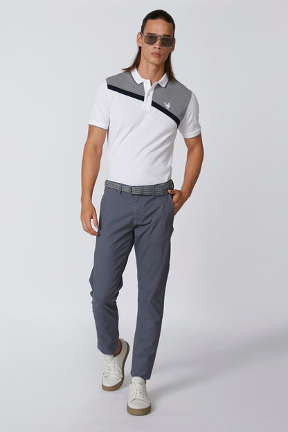 White short-sleeve polo shirt with navy color-block stripe and button-down collar