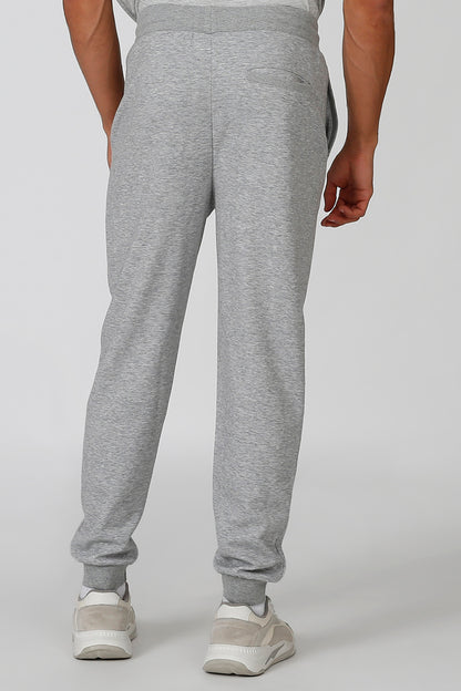 Grey jogger sweatpants with drawstring waist and ribbed ankle cuffs.