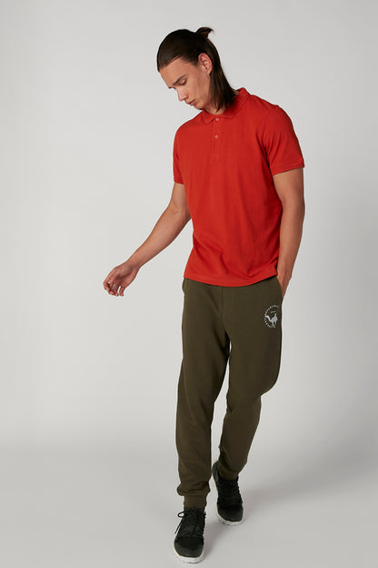 Splash olive green jogger pants with circular logo and tapered cuffs
