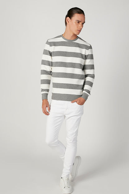 Grey and white striped crewneck sweater in side view
