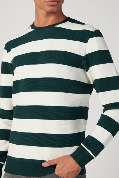 Men's dark green and white striped crewneck sweater close-up, ribbed cuffs
