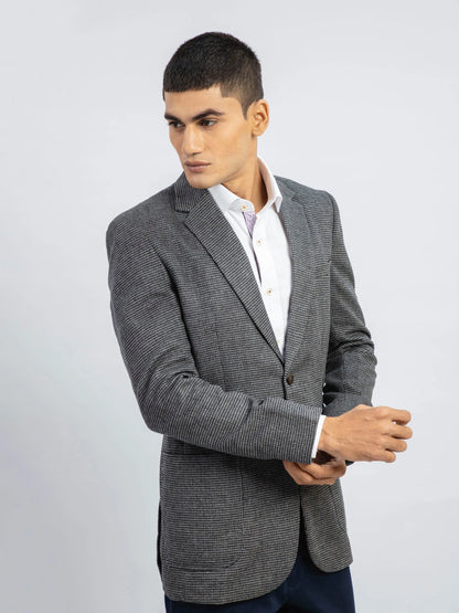 Grey textured single-breasted blazer with notch lapel and front flap pockets