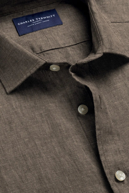 Dark brown button-up shirt with Charles Tyrwhitt neck label and round buttons