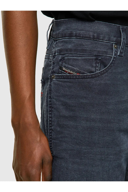 Dark blue denim jeans detail: front pockets, button fly, belt loops