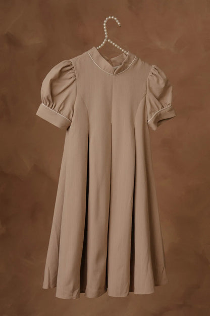 Stone short-sleeve dress on hanger with pleated bodice and flared skirt