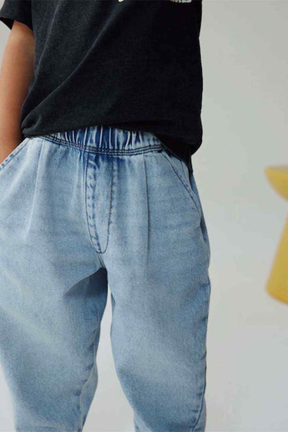 Light blue denim jeans with elastic waistband and cuffed legs