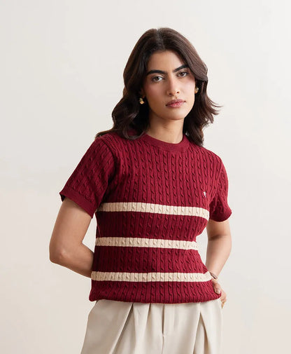 Red fitted knit crewneck top with short sleeves and cream striped bands, clean front view