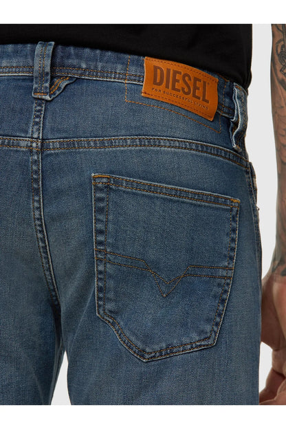 Blue denim jeans with orange Diesel label patch on back pocket