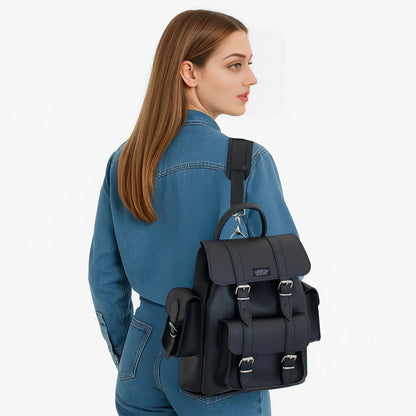 Black double-strap backpack with front flap pockets and buckled straps