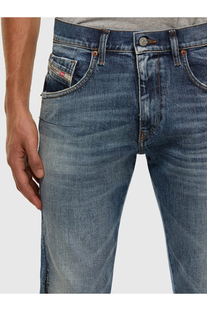 Diesel blue denim jeans close-up of front coin pocket and belt loops