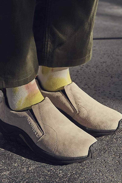 Taupe suede slip-on shoes with black rubber sole and side gore panel
