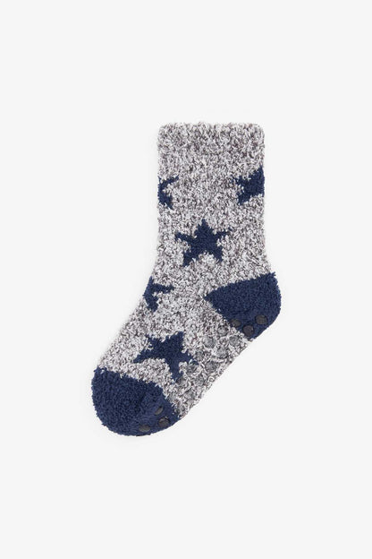 Fuzzy gray socks with white stars, navy cuff, rubber grip dots