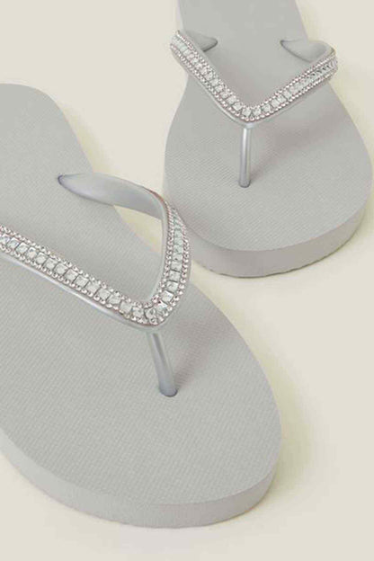 Silver rhinestone V-strap flip-flops on textured sole