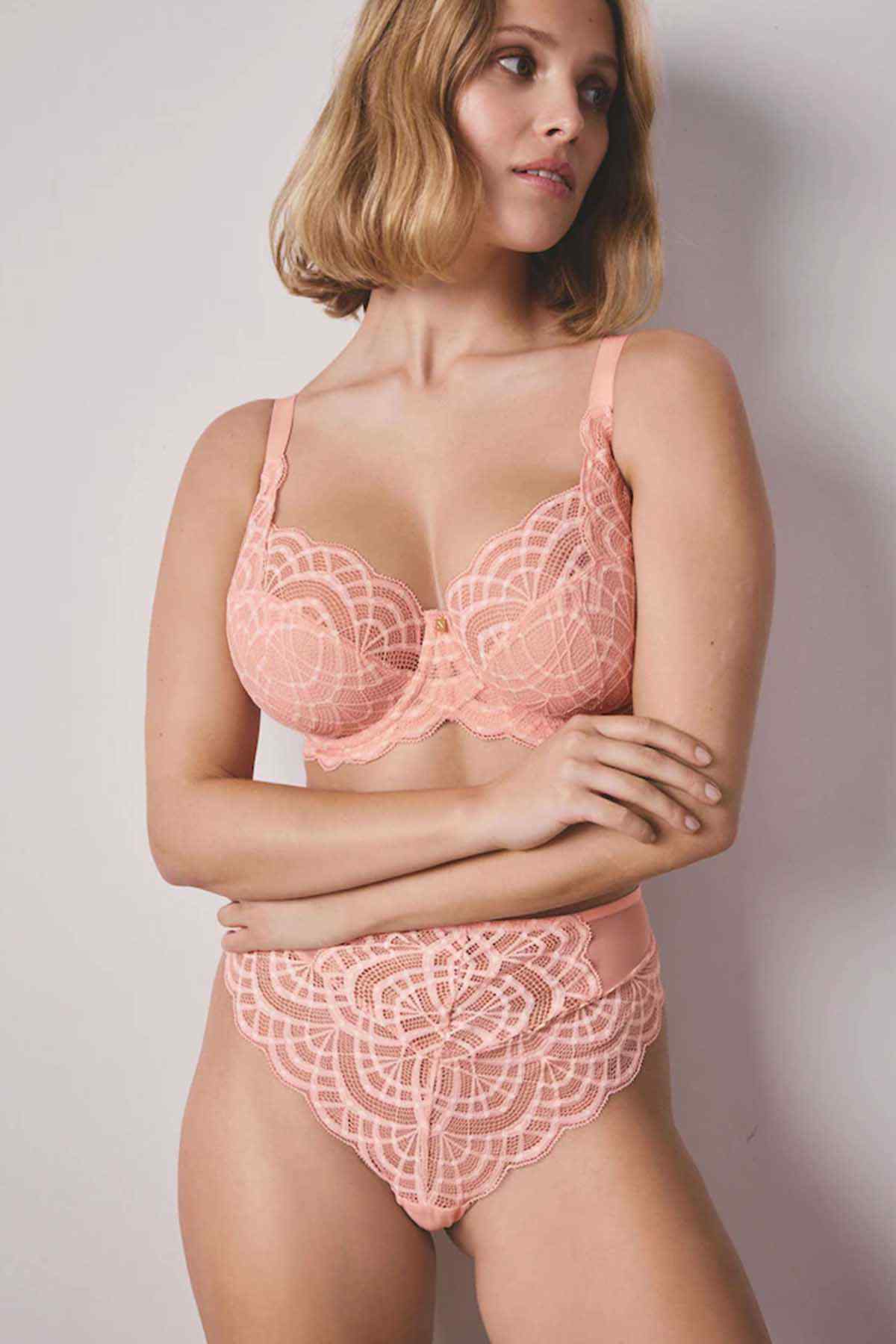Coral pink lace bra and briefs set, scalloped edges and underwire cups.