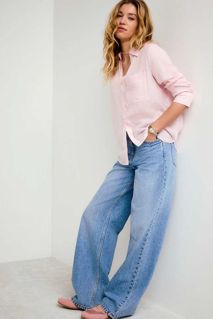 Pink button-up shirt with long sleeves and collar