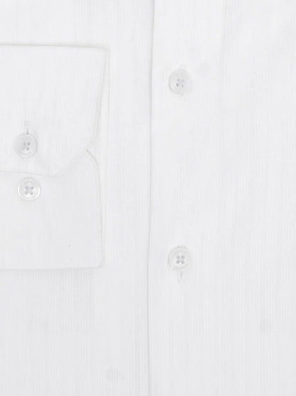 White cotton button-up shirt front with chest pocket and small buttons