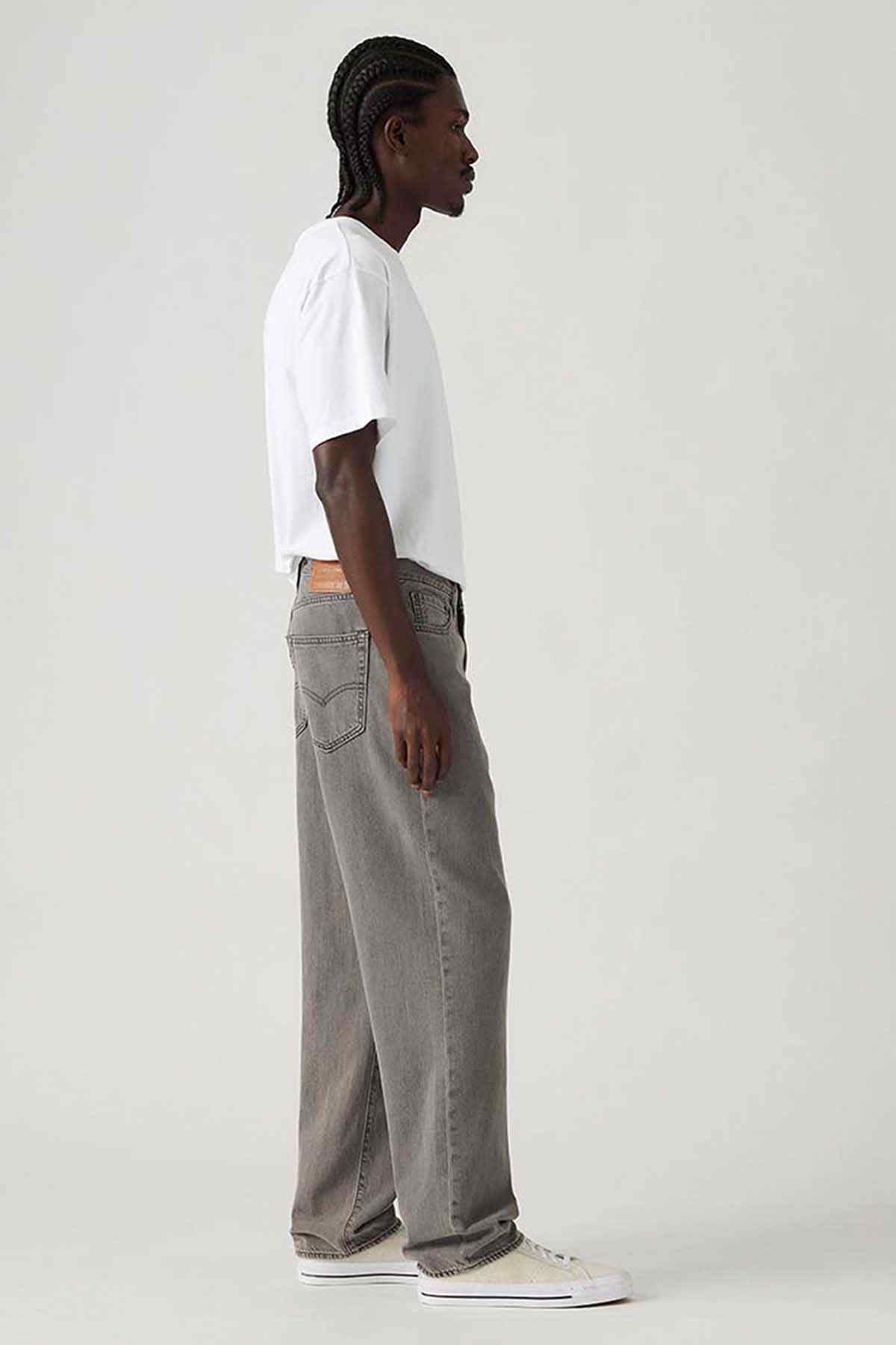 Grey denim jeans side view, straight leg and front pocket detail