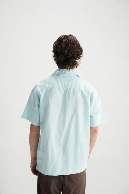 Sky blue short-sleeve button-up shirt, back view