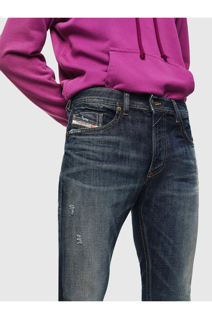Dark wash denim jeans close-up of waistband, button, and front pockets
