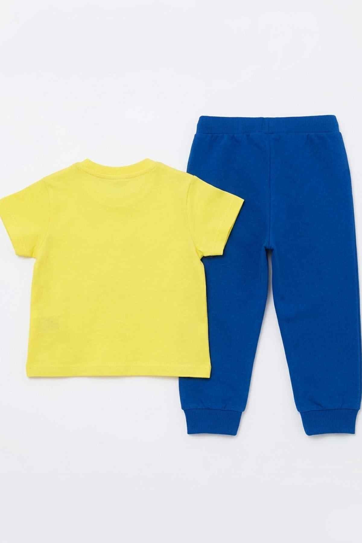 Yellow T-shirt and blue jogger pants laid flat, Superman rescue and logo