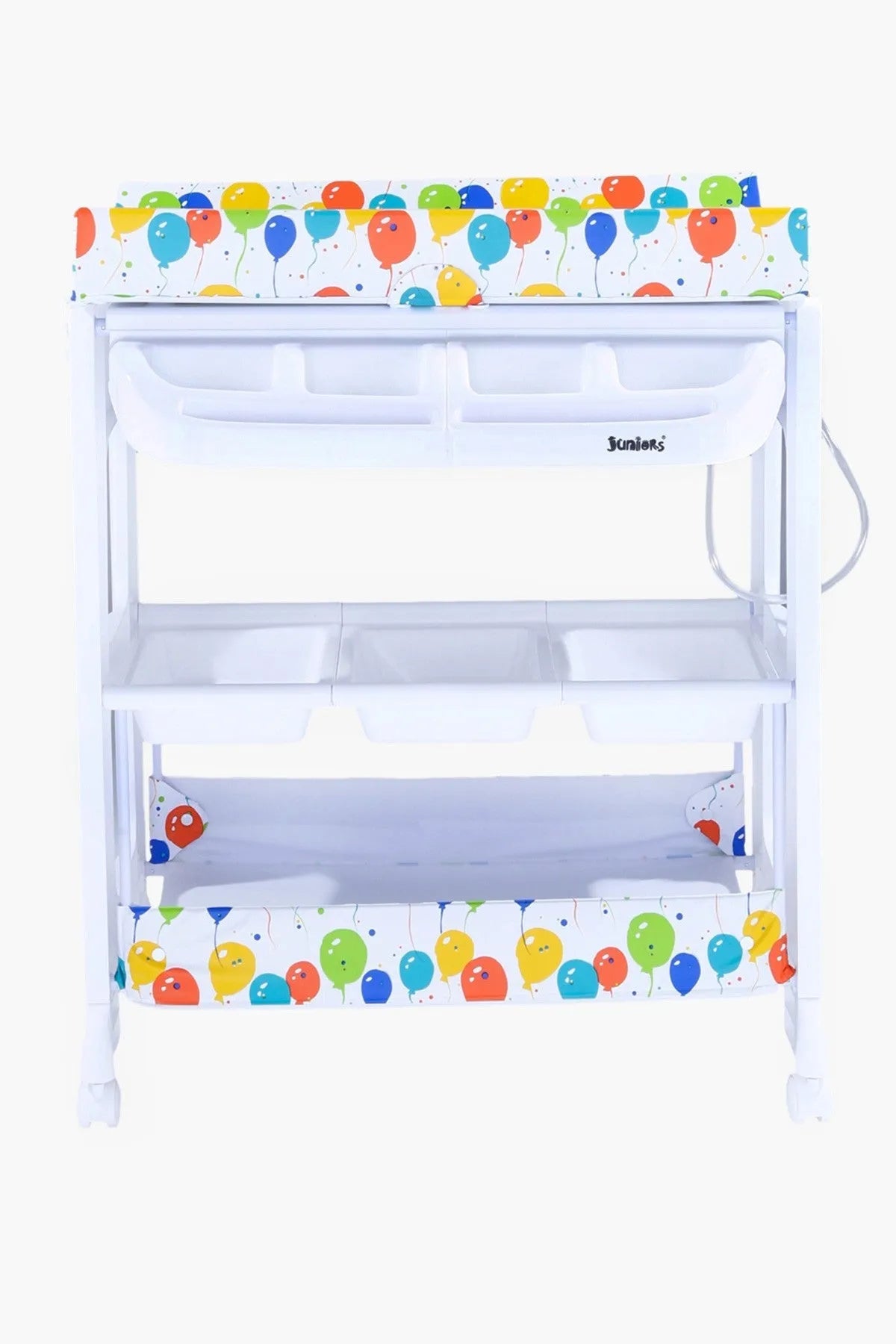White baby changing table with colorful cartoon top trim and three open storage shelves