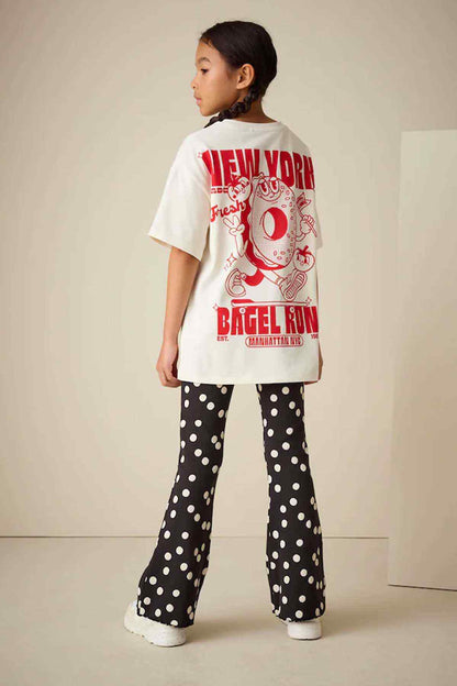 Kids graphic T-shirt back with black polka-dot flared pants, full outfit