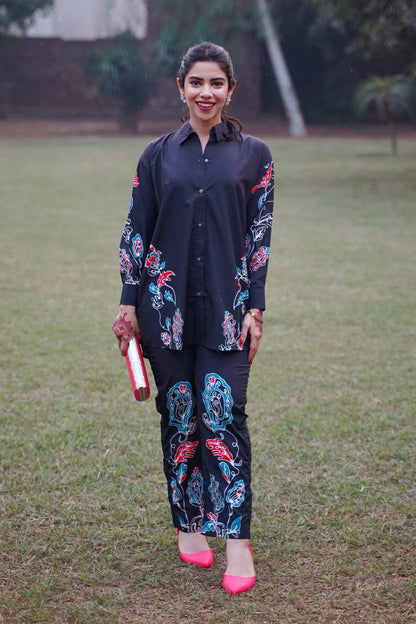 Black embroidered kurta and matching pants set with floral sleeves and front print