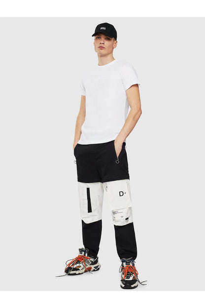 Men's white Diesel T-shirt with crew neck, black shorts and sneakers, full-body