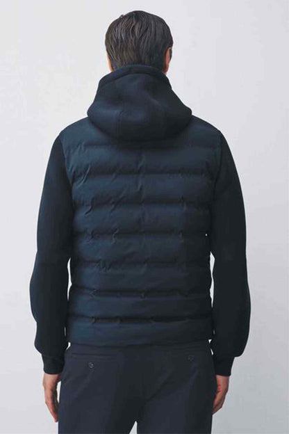 Navy quilted puffer jacket back view with hood and full-length zipper
