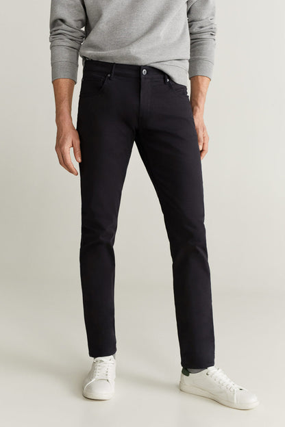 Black slim pants with belt loops, button closure, and side pockets.