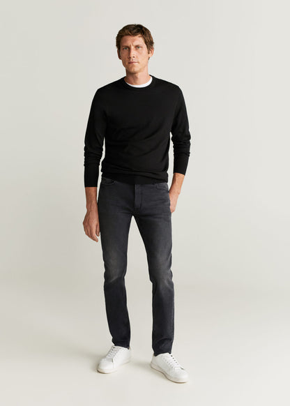 Men's dark grey denim jeans with straight legs and cuffs, full-body view