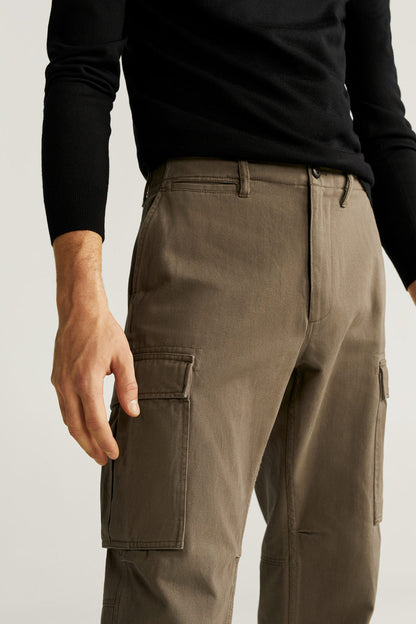 Khaki cargo pants with flap side pockets and buttoned front